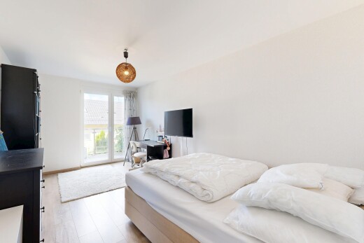 room / bedroom with light wood finished floors, access to exterior, and pendant lighting