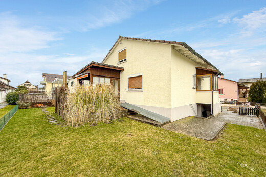 view of home featuring stucco siding and a patio area