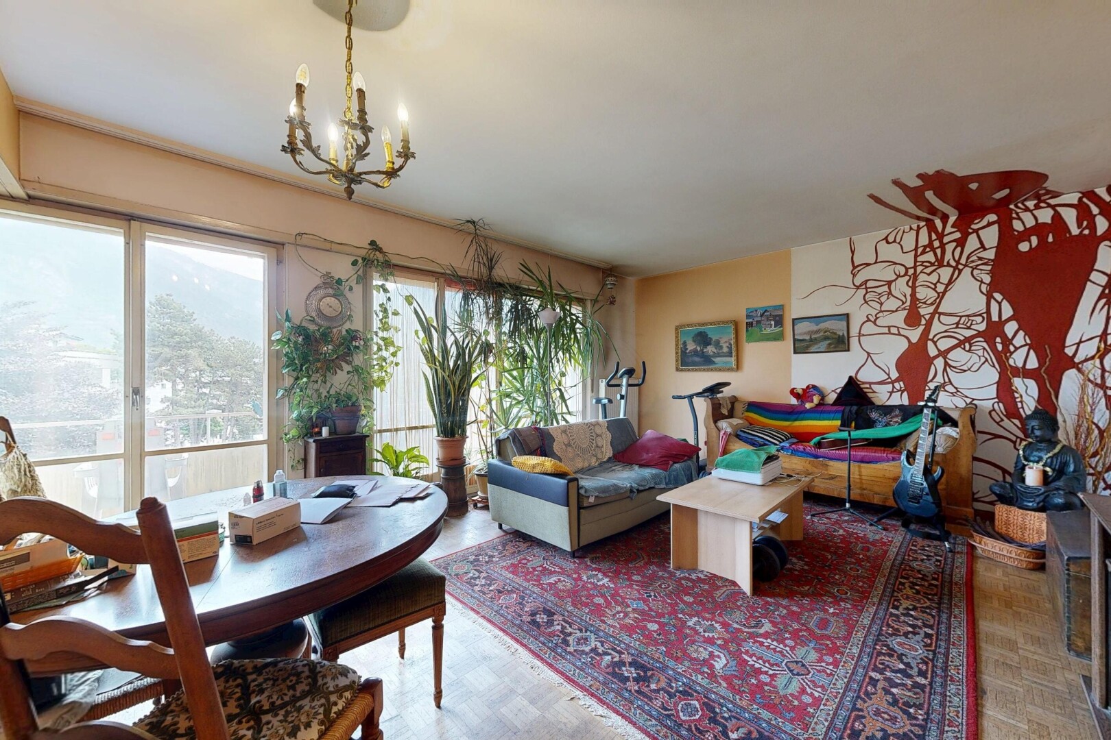 living / dining room with suspended lighting