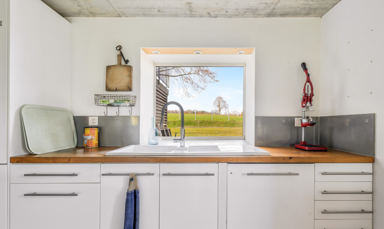kitchen with white cabinets and butcher block counters