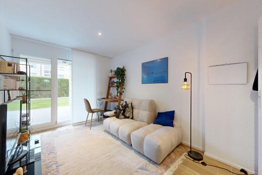 living area with wood finished floors and recessed lighting