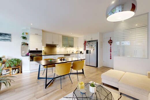 kitchen with stainless steel appliances, white cabinetry, light wood-type flooring, tasteful backsplash, and dark countertops