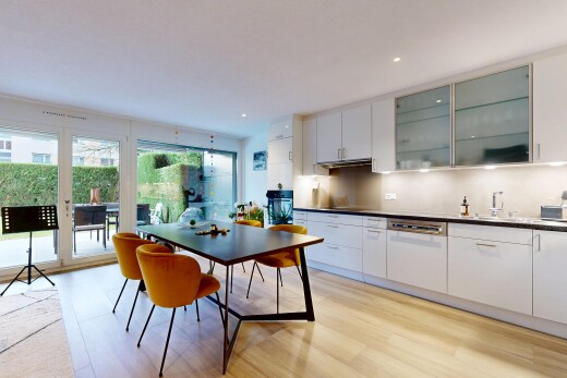 kitchen with white cabinetry, dark countertops, glass insert cabinets, tasteful backsplash, and recessed lighting