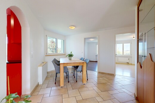 dining area with healthy amount of natural light and stone tile flooring