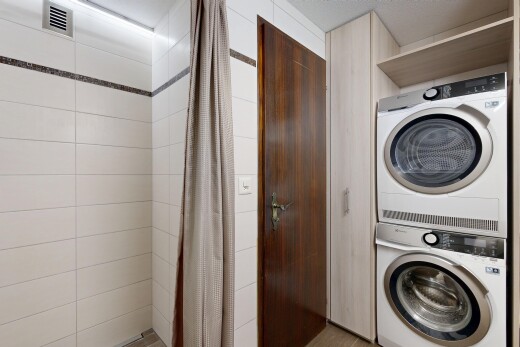 laundry area featuring stacked washer and dryer