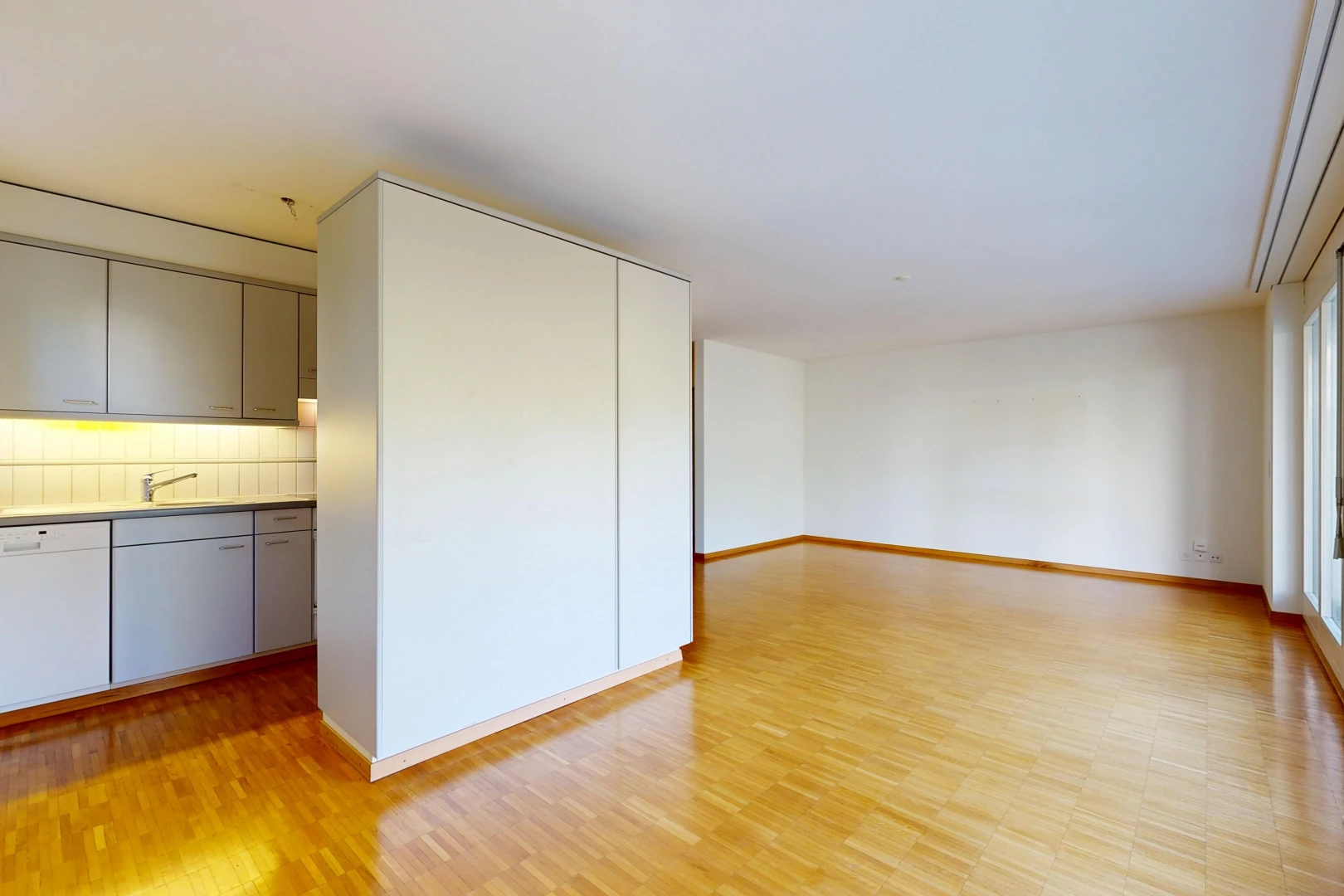 spare room featuring a sink and light wood-type flooring