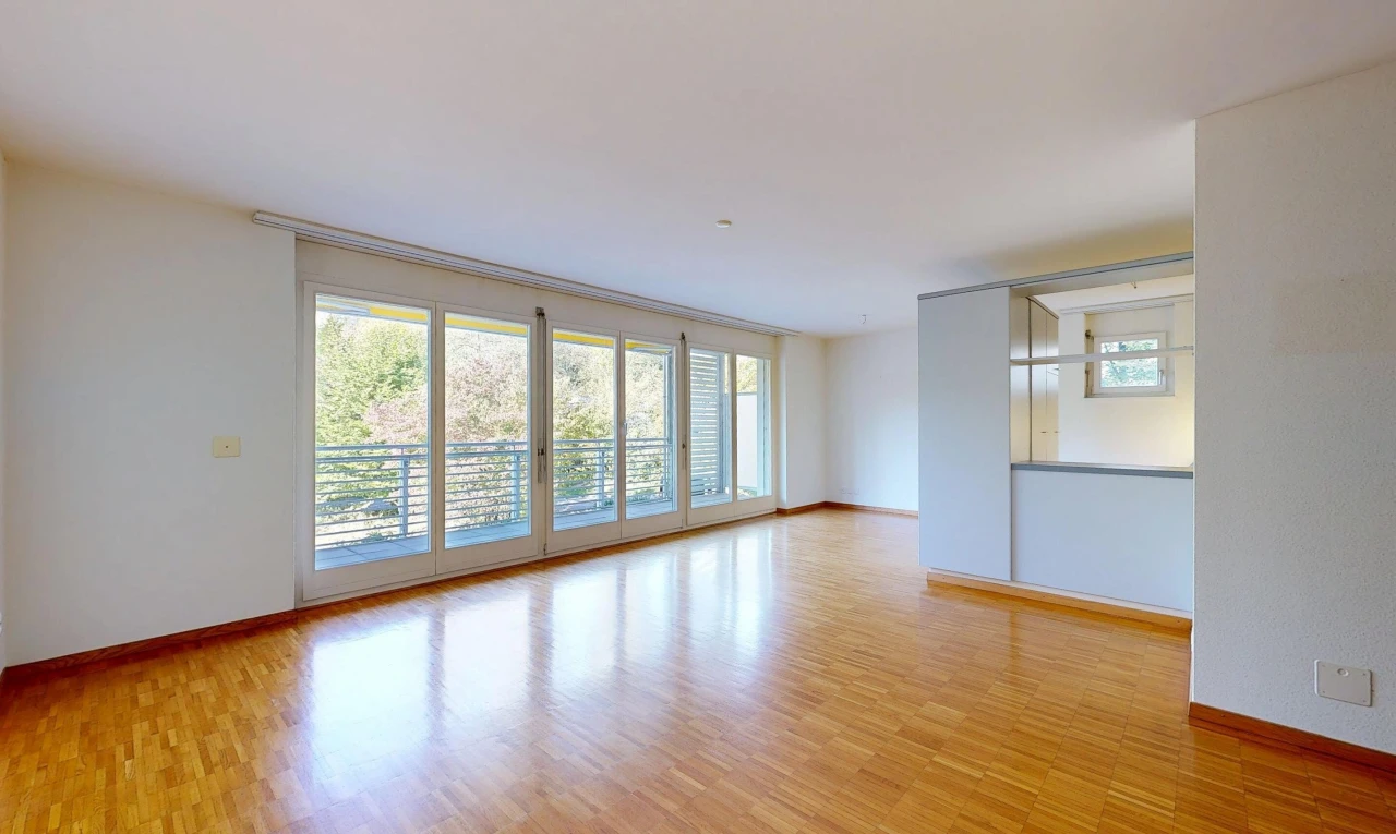 empty room featuring light wood-style flooring and access to outside