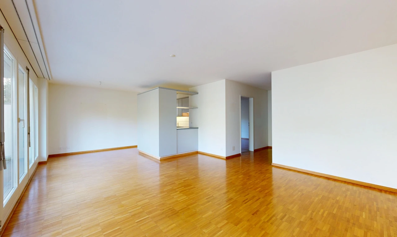 spare room featuring baseboards and light wood-type flooring