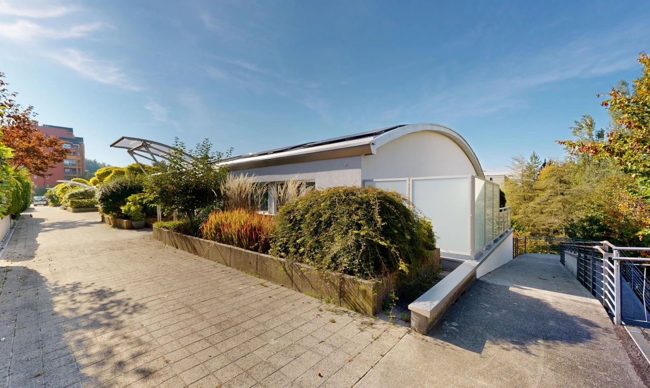 view of home with roof mounted solar panels