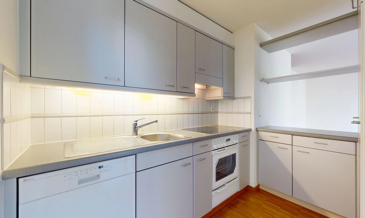 kitchen featuring white appliances, light countertops, light wood-type flooring, gray cabinets, and tasteful backsplash