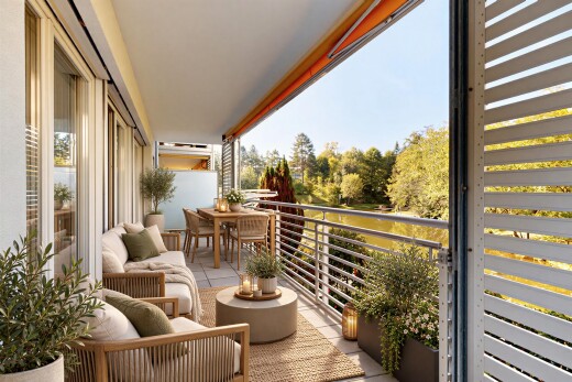 balcony with a water view and an outdoor living / dining area