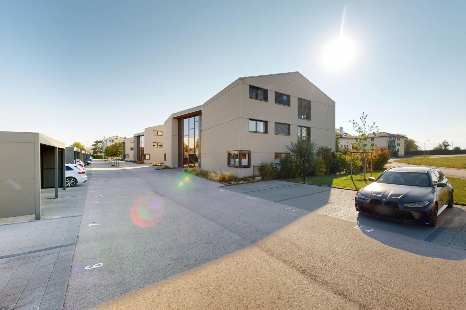 view of apartment building / complex featuring uncovered parking