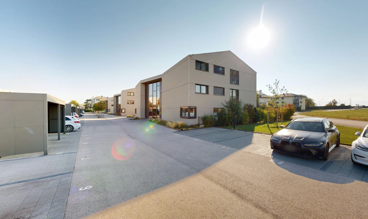 view of apartment building / complex featuring uncovered parking