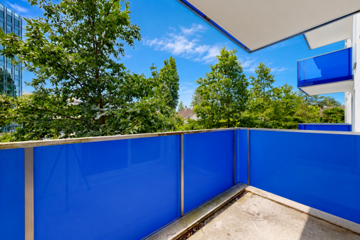 view of pool with a balcony