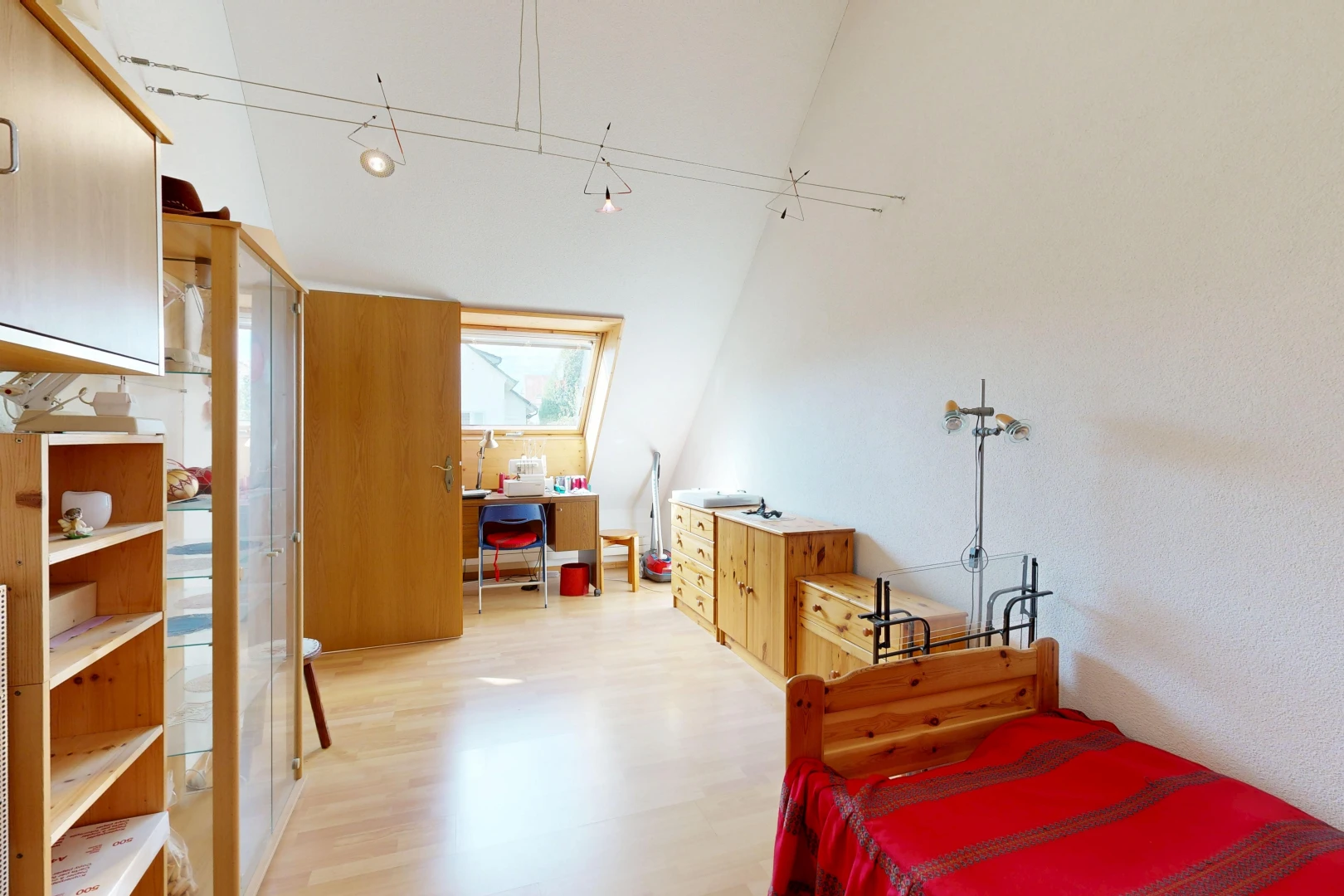 room featuring a high ceiling and light wood-type flooring