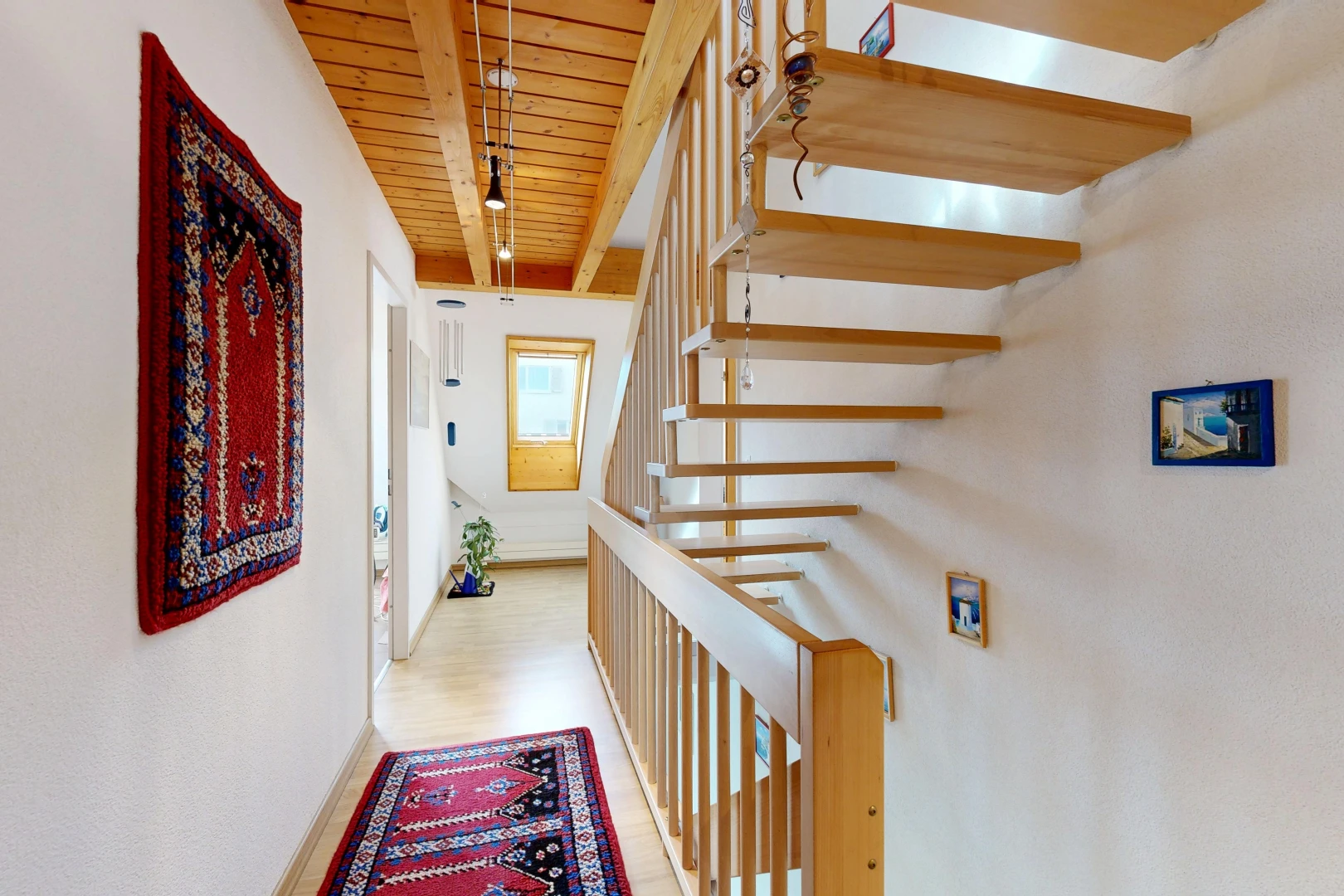 staircase with wooden ceiling and light wood-style floors