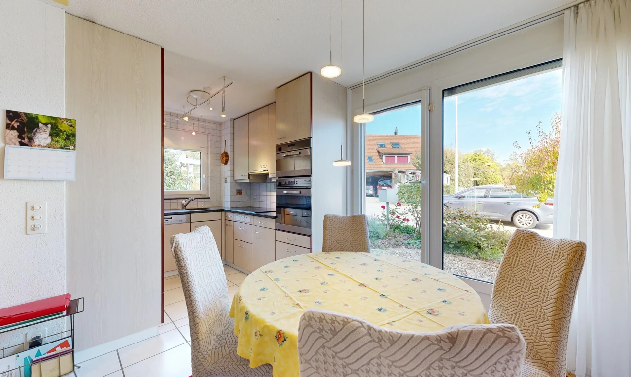dining area featuring light tile patterned floors and hanging light fixtures