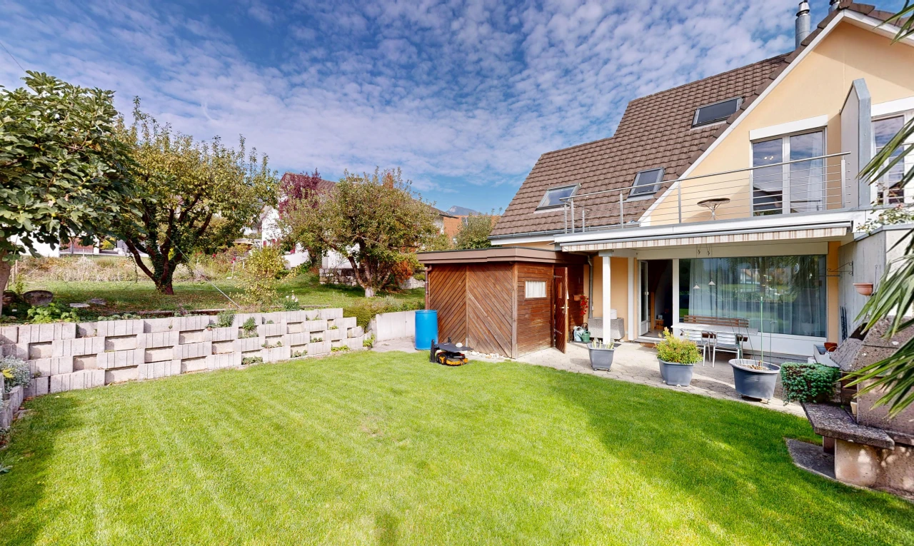 view of home with a yard and a patio