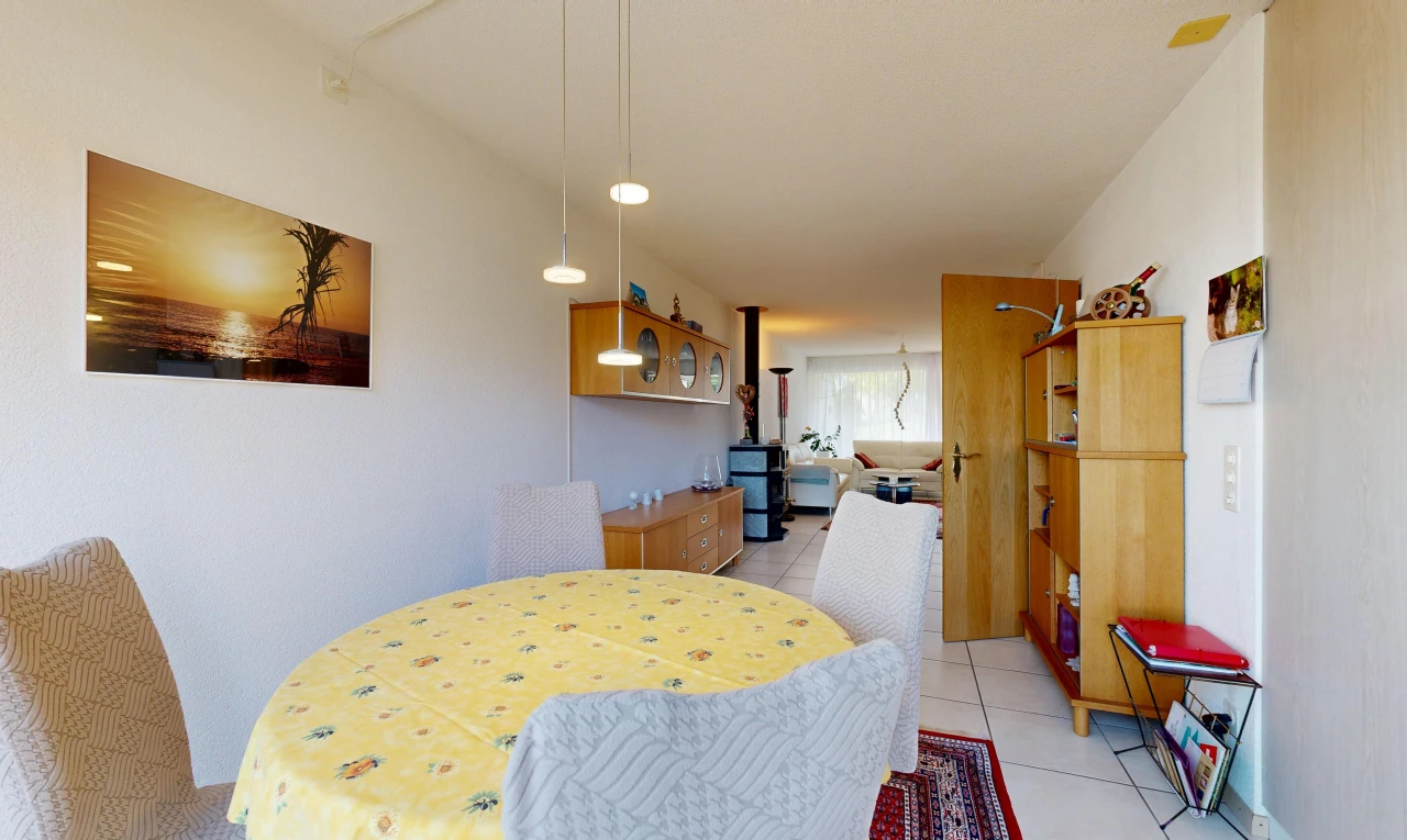 dining area featuring pendant lighting and light tile patterned floors