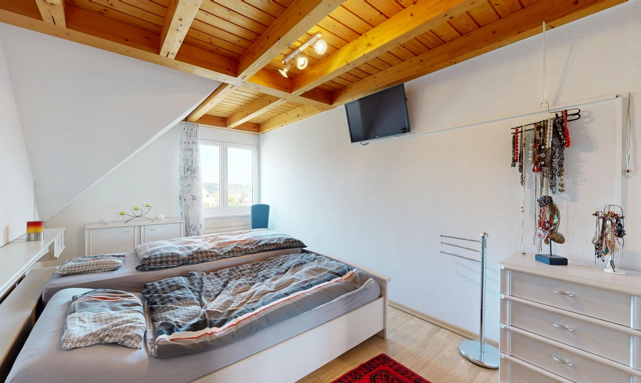 room / bedroom featuring a wooden ceiling with exposed beams and light wood-style floors