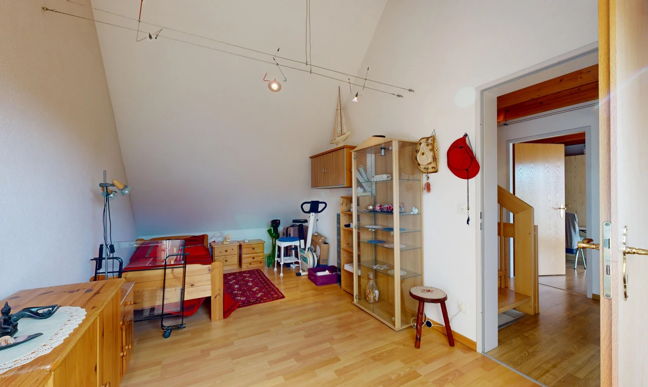 living room featuring light wood-style floors and vaulted ceiling