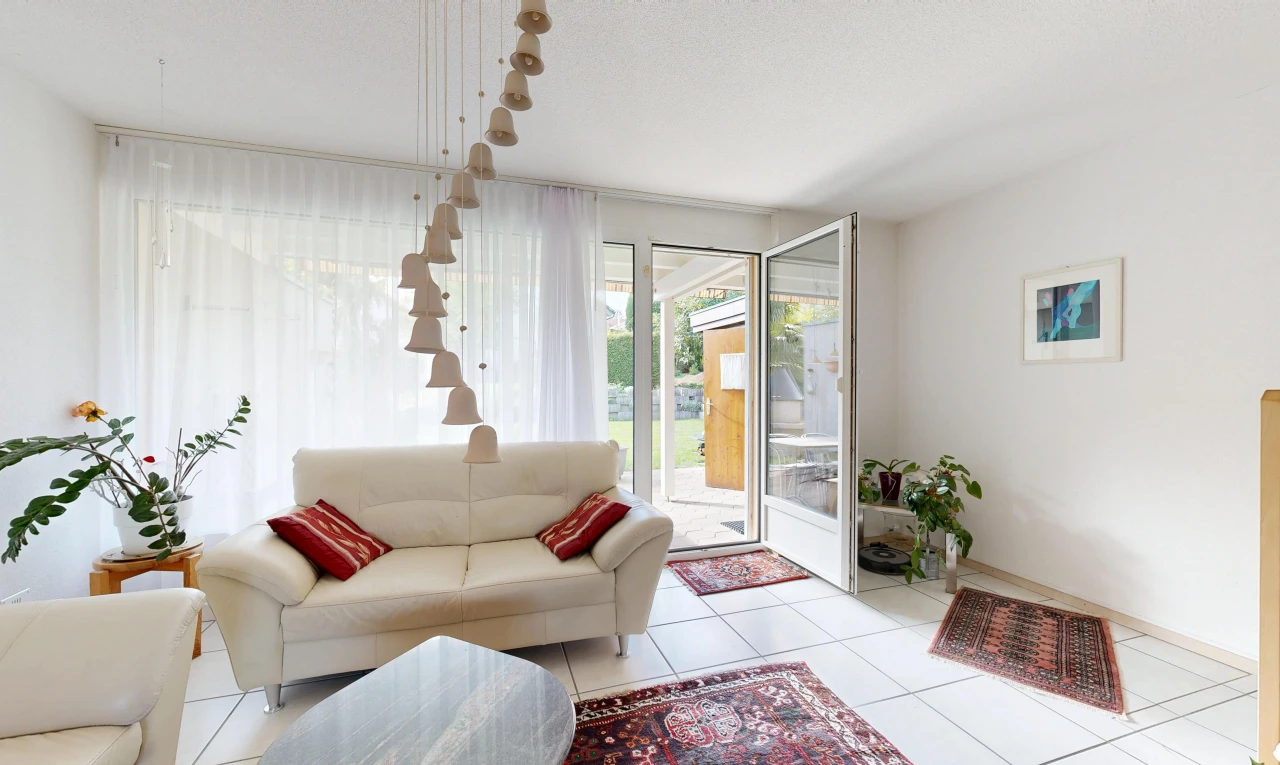 living room featuring access to outside and light tile patterned floors