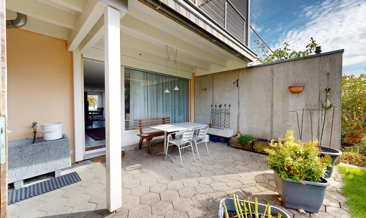 terrace featuring outdoor dining space and a patio area