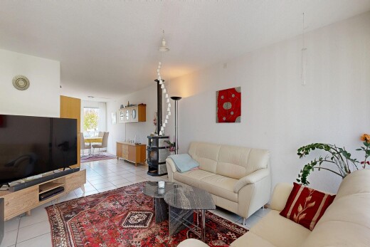 living room with light tile patterned floors