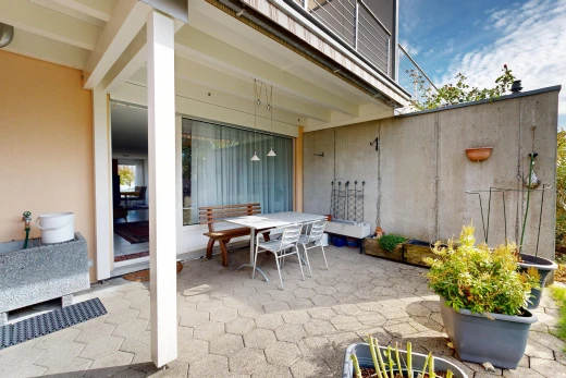 terrace featuring outdoor dining space and a patio area