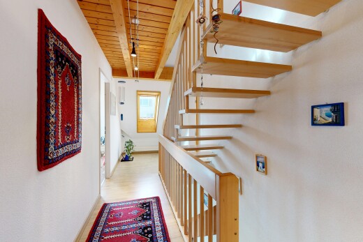staircase with wooden ceiling and light wood-style floors
