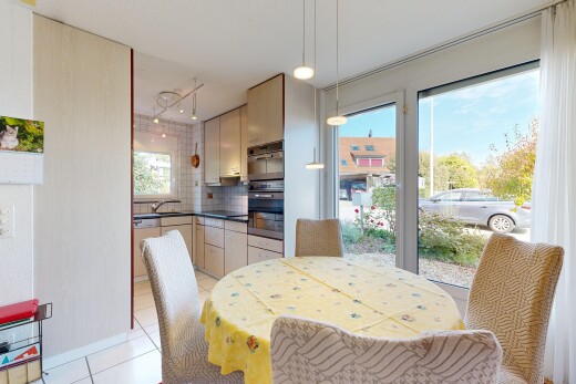 dining area featuring light tile patterned floors and hanging light fixtures