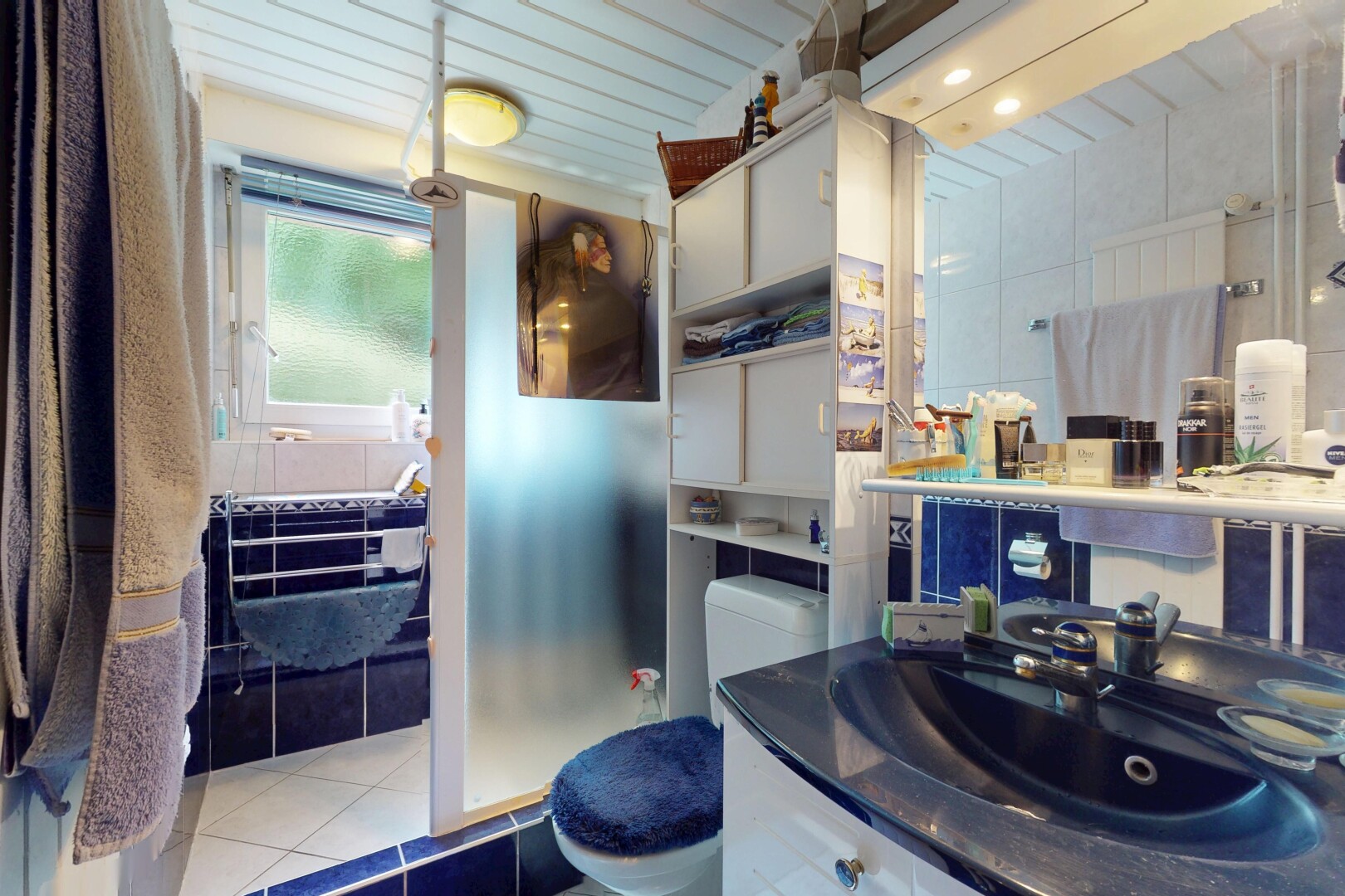 full bathroom featuring tile patterned flooring and vanity