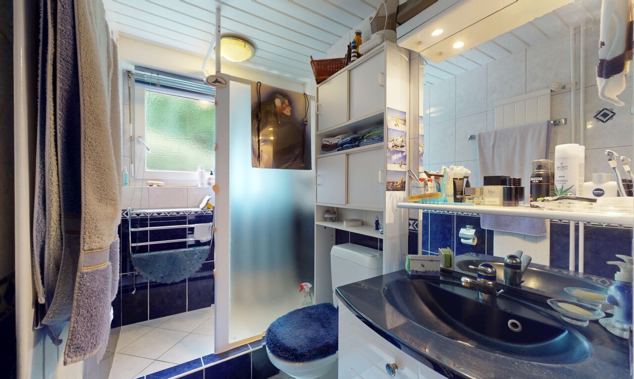 full bathroom featuring tile patterned flooring and vanity