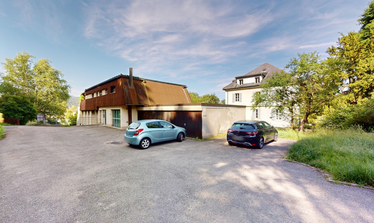 view of property with uncovered parking