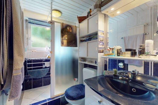 full bathroom featuring tile patterned flooring and vanity