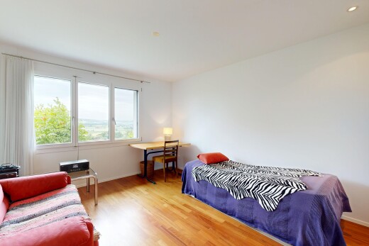 chambre avec cloison sèche, drywall, sol en finition bois, wood finish floor, et inside property