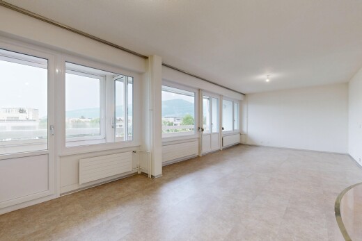 spare room with radiator heating unit and light floors