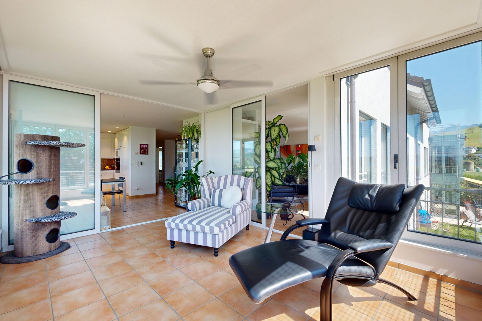 terrace featuring a ceiling fan