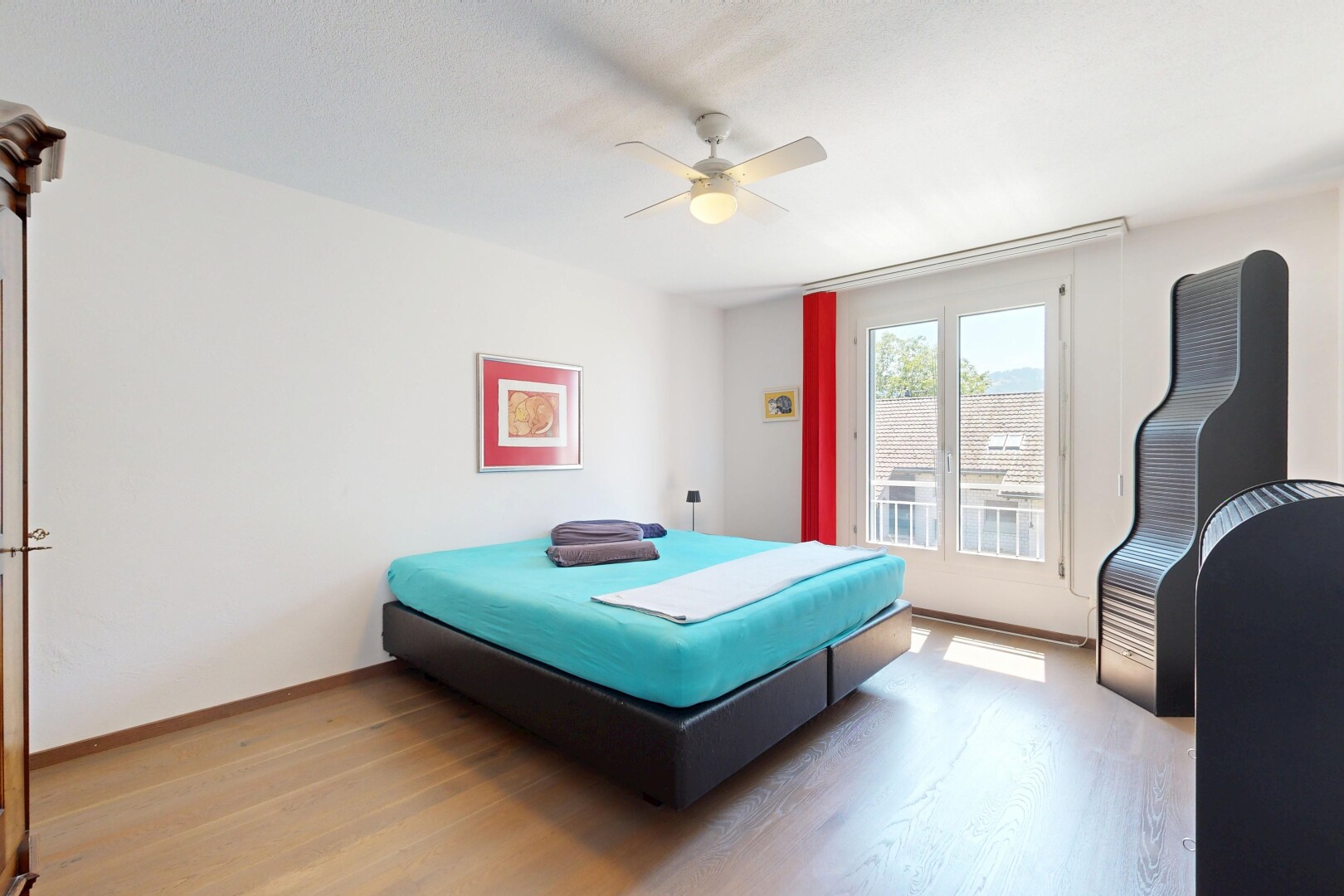 room / bedroom featuring light wood finished floors and ceiling fan