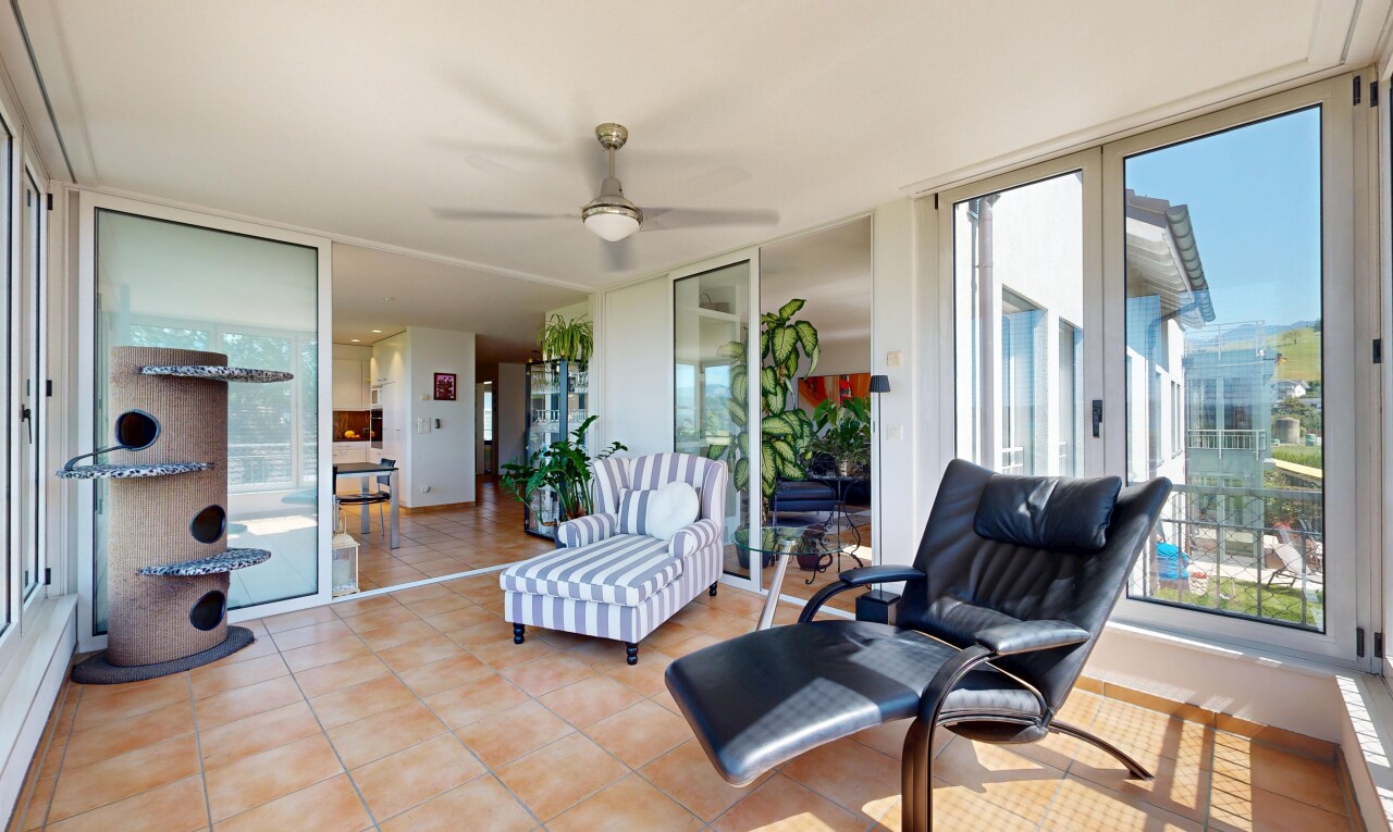 terrace featuring a ceiling fan