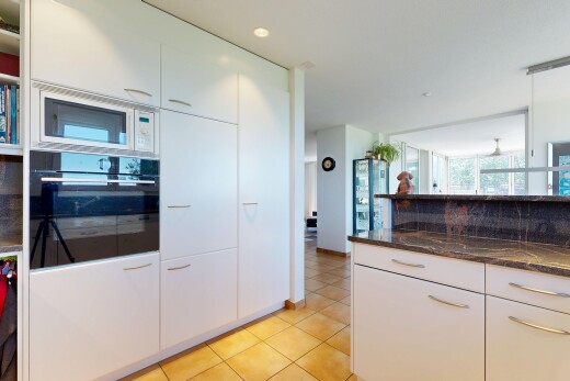 kitchen featuring oven, white cabinets, dark stone counters, white microwave, and light tile patterned floors