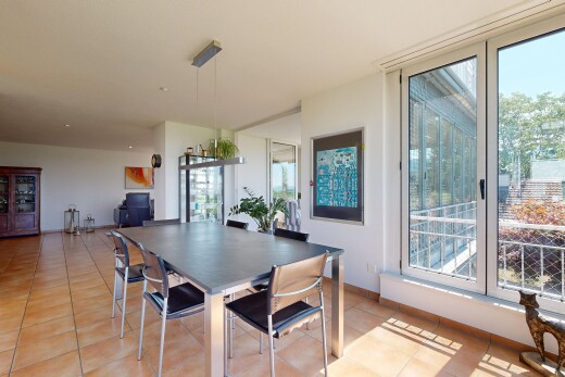dining room with light tile patterned floors and baseboards