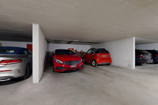 view of parking featuring a parking deck