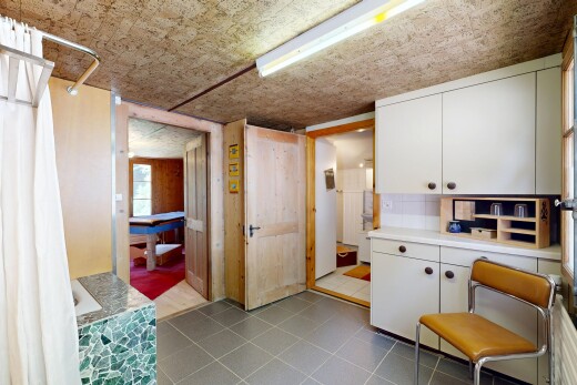 kitchen featuring light countertops and white cabinets