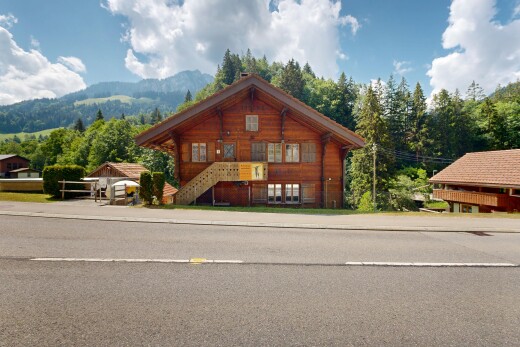 view of property with stairway and a mountain view