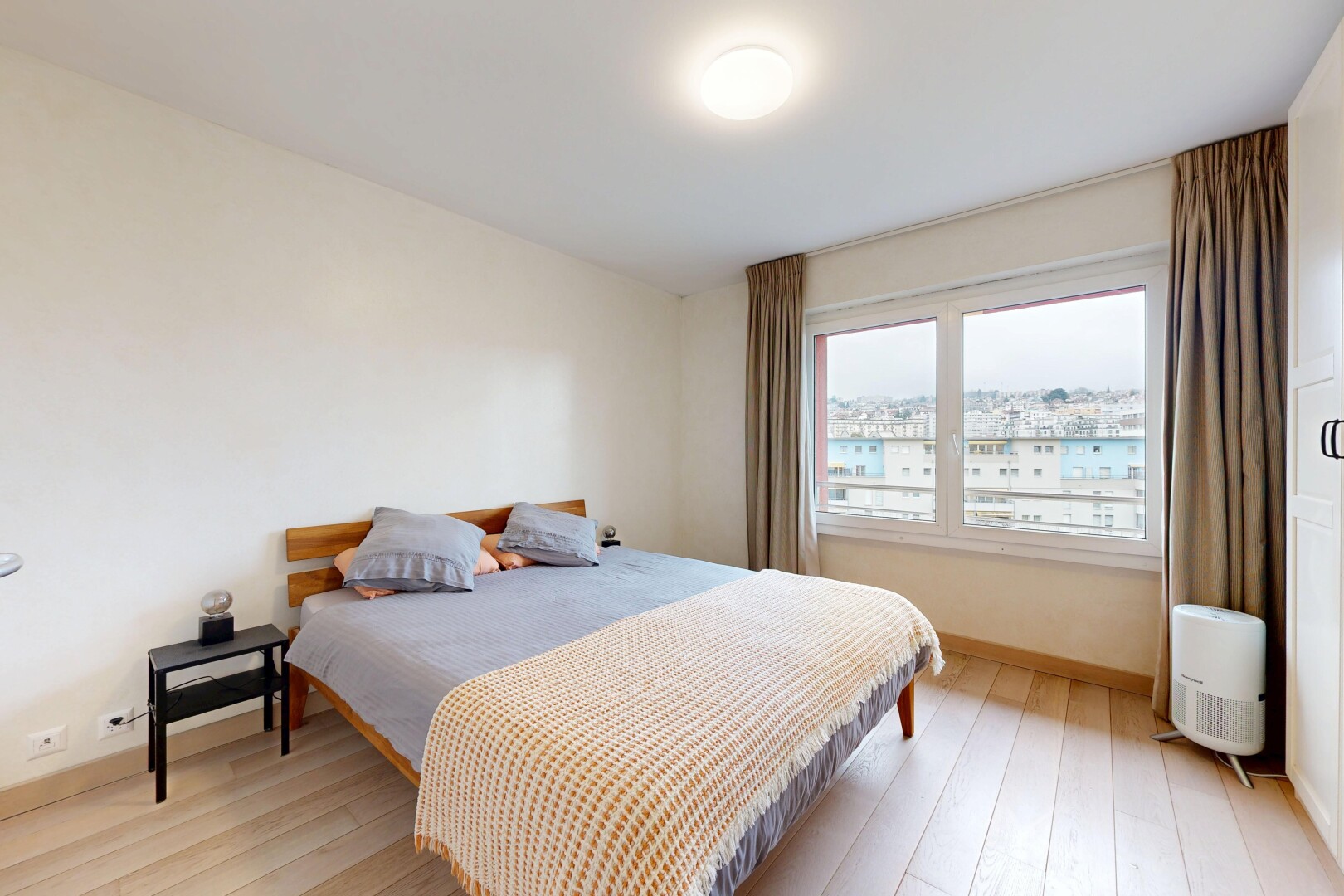 room / bedroom featuring light wood finished floors and baseboards