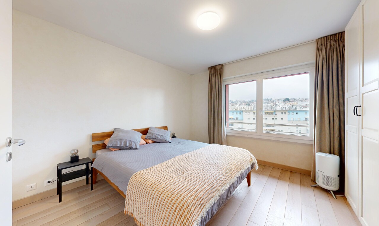 room / bedroom featuring light wood finished floors and baseboards