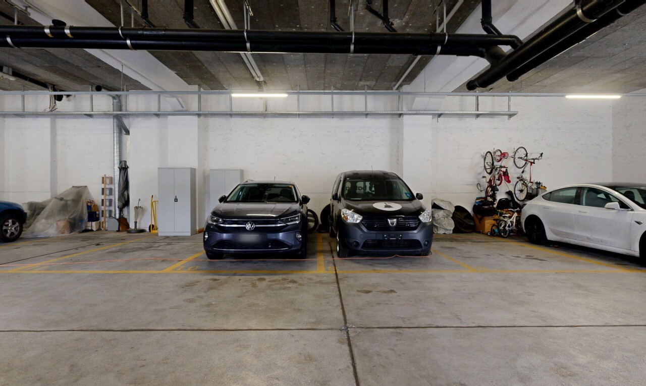 view of parking featuring a parking deck