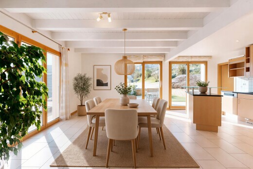 dining room with beamed ceiling and light tile patterned floors