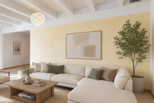 living area with beam ceiling and hanging light fixtures